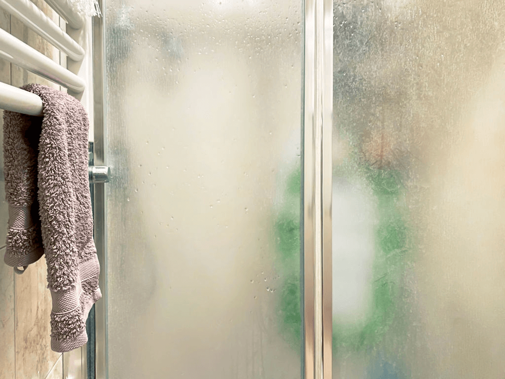 How to remove hard water stains from glass shower doors - WD-40 Australia