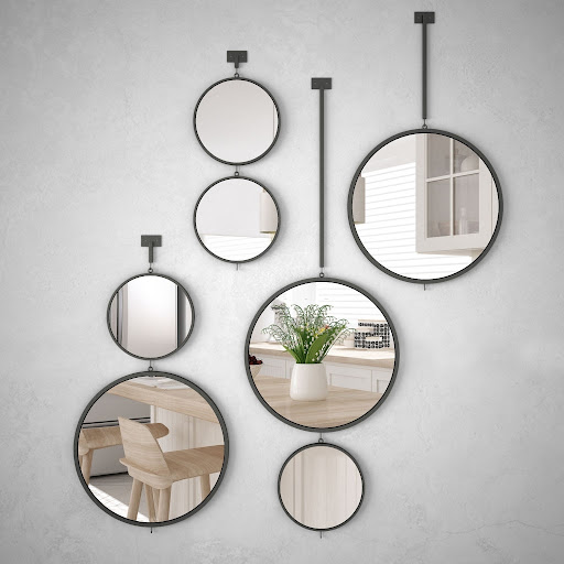 Multiple Round Mirrors on a Hallway Wall