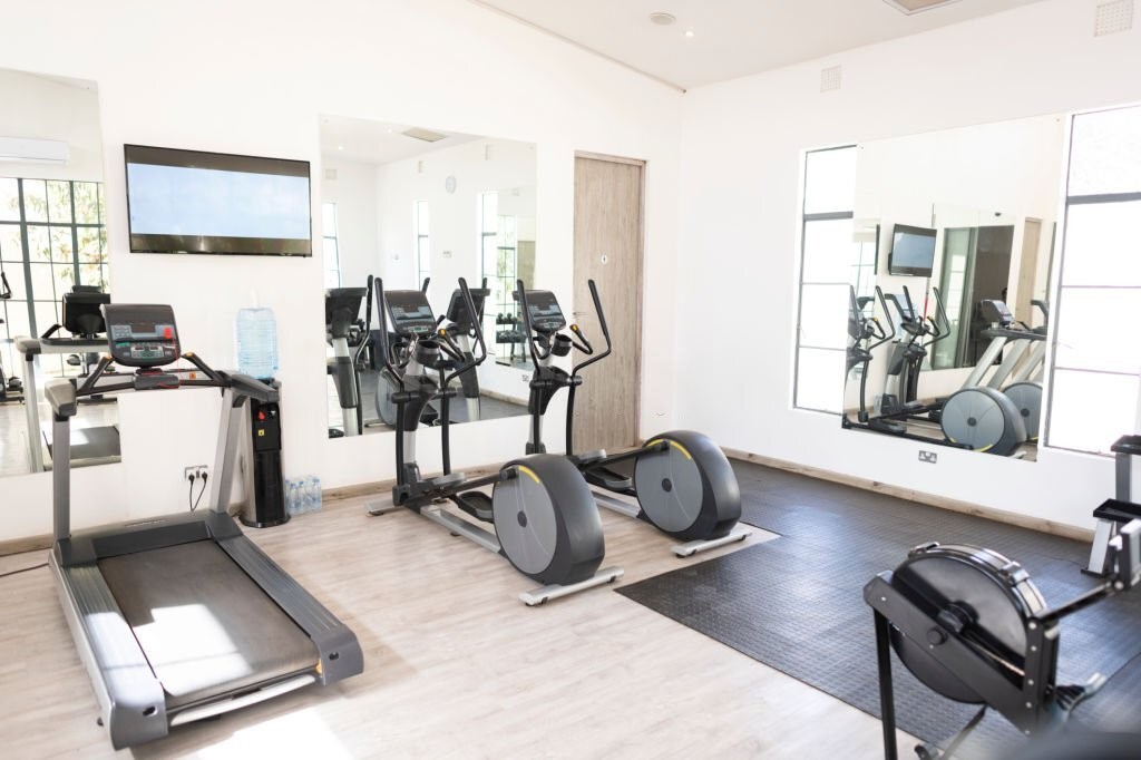 Brighten Up the Garage Gym with All-White Design