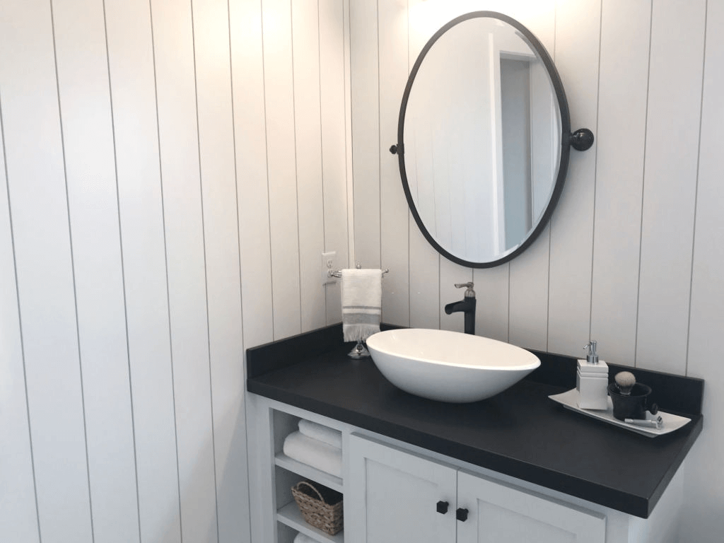 Oval Shaped Mirror Above Sink