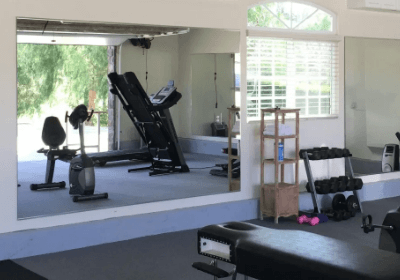 Installing a DIY home gym mirror wall for cheap!